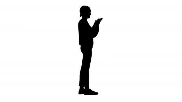 Silhouette Confused young woman using smartphone with mixed emotions. — Stock Video