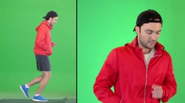Yeşil Ekranda rüzgarlıkla koşan sportif adam, Chroma Key.
