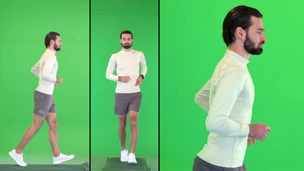 Knappe blanke mannelijke atleet joggen op een groen scherm, Chroma Key. — Stockvideo