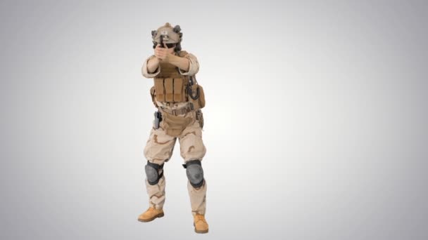Modern soldier, counter terrorist squad fighter shooting with a pistol on gradient background. — Stock Video