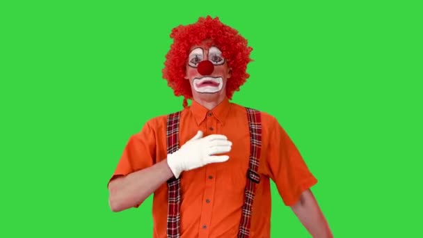 Funny clown walking like he is marching on a parade on a Green Screen, Chroma Key. — Stock Video