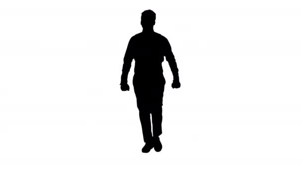 シルエット・アフリカ系アメリカ人のビジネスマンが眼鏡をかけ、歩きながら手で踊る. — ストック動画