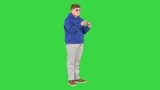 Teenager actively playing video game on a Green Screen, Chroma Key. — Stock Video