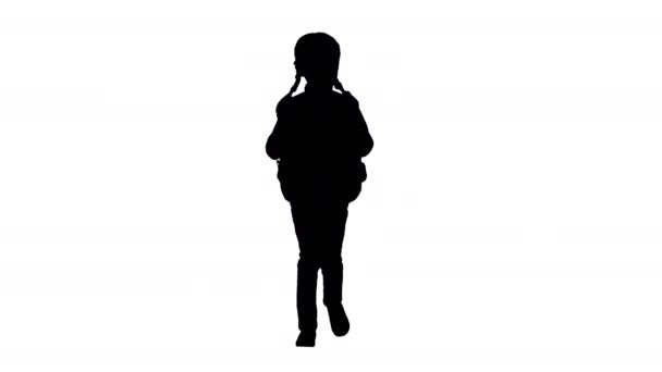 Silueta Sonriente niña caminando a la escuela con una mochila. — Vídeos de Stock