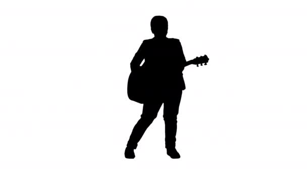 Silhouette Boy em branco tocando guitarra acústica e dança. — Vídeo de Stock