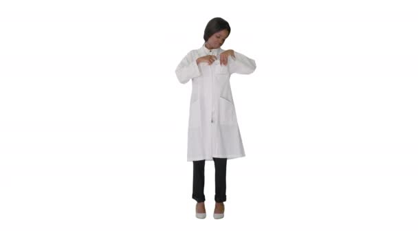 Young pretty doctor black woman fixing her badge on white background. — Stock Video