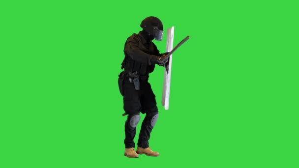 Riot police pushing forward with shield and baton up on a Green Screen, Chroma Key. — Stock Video