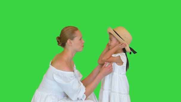 Mother and daughter talking with each other on a Green Screen, Chroma Key. — Stock Video