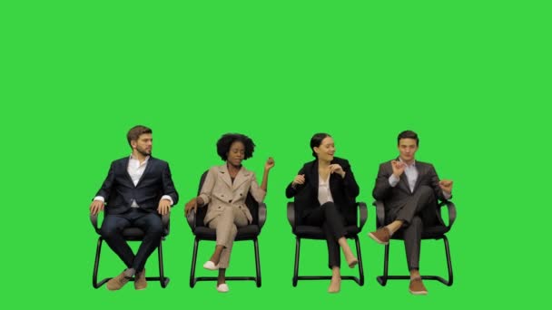 Young office workers having fun on a break, shaking to some music on a Green Screen, Chroma Key. — Stock Video