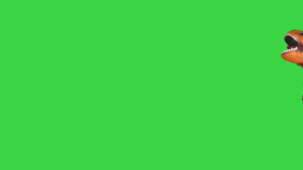 Dinosauro che salta nel telaio e fugge su uno schermo verde, Chroma Key. — Video Stock