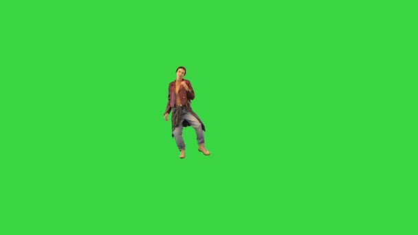 Stylish girl walking on camera and dancing on a Green Screen, Chroma Key. — Stock Video