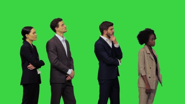 Young office people hearing some pleasant news and start clapping on a Green Screen, Chroma Key. — Stock Video