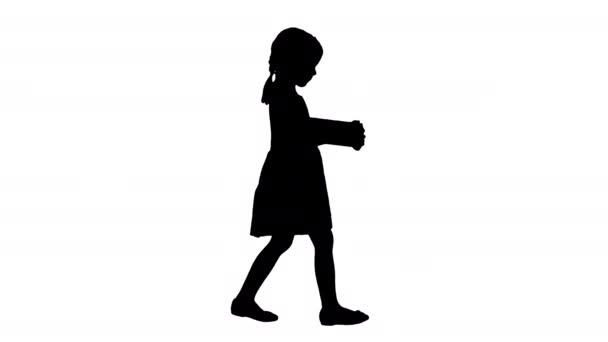 Silhouette Little girl in black dress walking with a gift box in her hands. — Stock Video