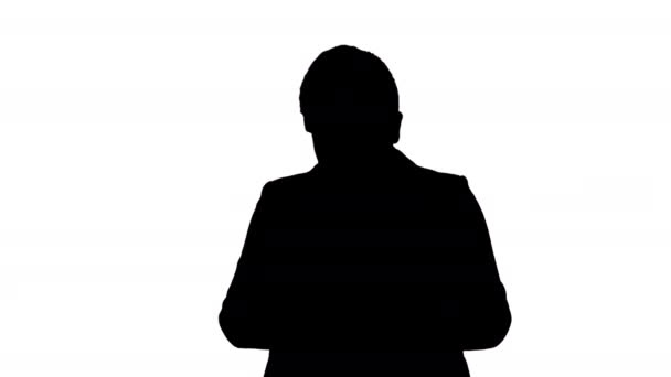 Silhouette Young teenager boy in business suit using mobile phone. — Stock Video