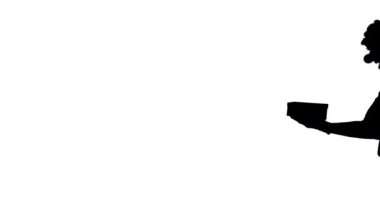 Siluet Mutlu palyaço hediyesini yürürken tutuyor.