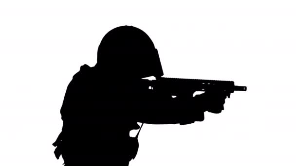 Silhouette Police anti terrorism squad fighter shooting from rifle. — Stock Video