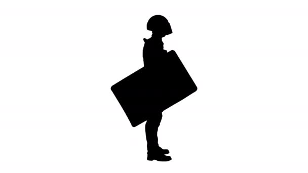 Silhouette Policeman in full riot gear standing with the shield down. — Stock Video