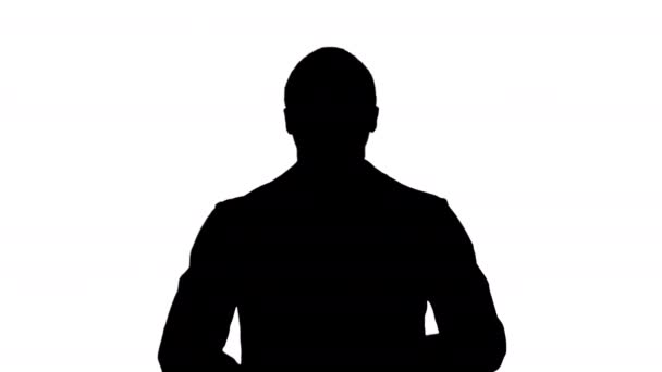 Silhouette Hombre negro guapo en chaqueta negra sonriendo y señalando un dedo. — Vídeos de Stock