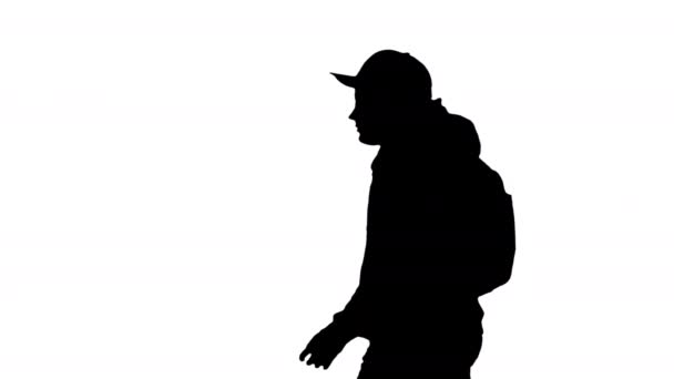 Silhouette Schoolboy with backpack walking by. — Stock Video