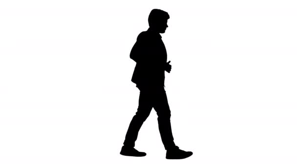 Silueta Éxito adolescente de negocios en traje blanco caminando. — Vídeos de Stock
