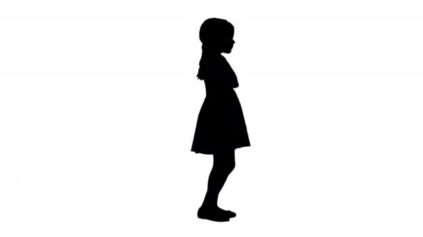 Силует Маленька дівчинка в точковій сукні Полька танцює і піднімає руки . — стокове відео