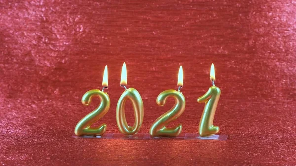 Burning golden New Year candles 2021 on red background. modern concept. — Stock Photo, Image