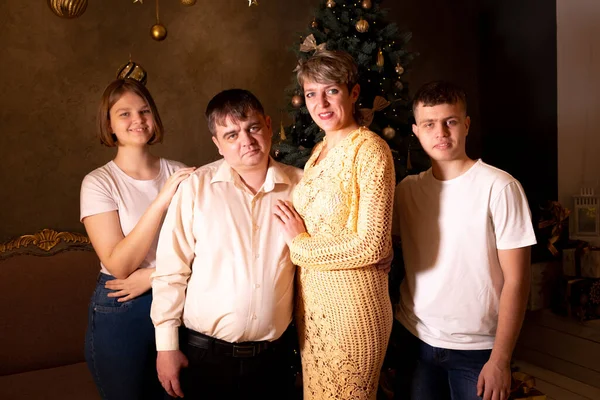 Family portrait near Christmas tree — Stock Photo, Image