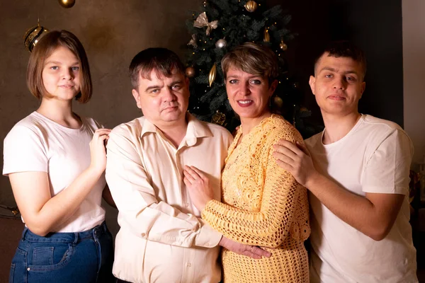 Family portrait near Christmas tree — Stock Photo, Image