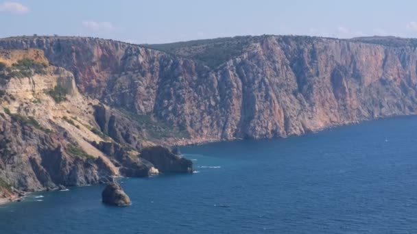 Beautiful view of the coast of the turquoise sea and mountains at Cape Fiolent, Crimea. The concept of tranquility, silence and unity with nature. — Stock Video