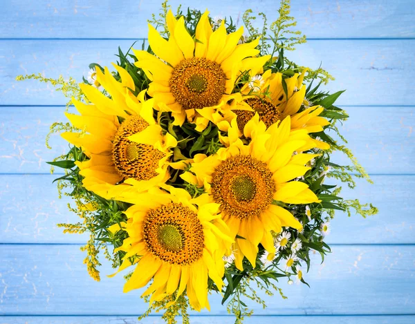 Sunflowers on blue background — Stock Photo, Image
