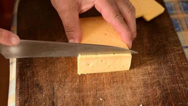 Man Knife Cutting Board Cuts Cheese Thin Slices — Stock Video