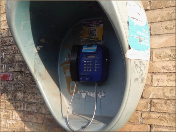 Public street telephone on the wall of the house. — Stock Photo, Image