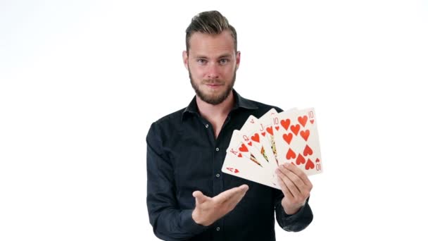 Attractive man with big playing cards royal flush — Stock Video