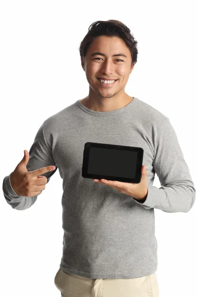 Attractive man with a digital reader Royalty Free Stock Photos