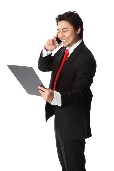 Businessman on the phone holding paper — Stock Photo, Image