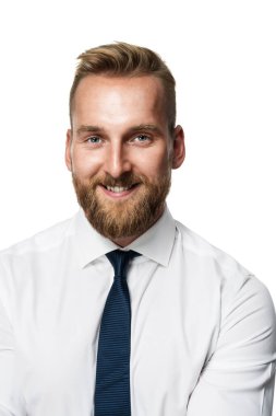 Portrait of a handsome businessman wearing a white shirt and blue tie looking directly at camera. White background.