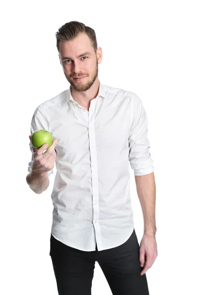 Jovem segurando uma maçã verde — Fotografia de Stock