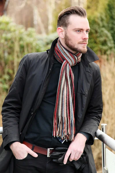 Man standing outside wearing a jacket — Stock Photo, Image