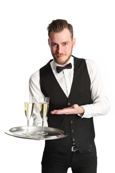 Kellner in seinen Zwanzigern serviert Champagner — Stockfoto