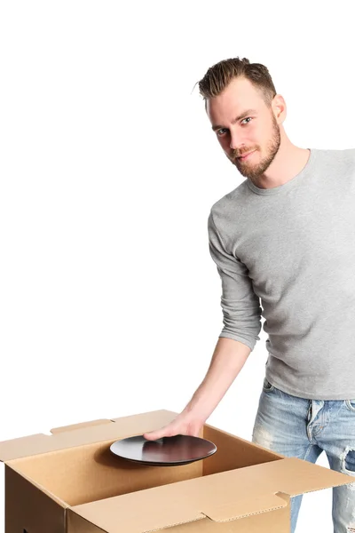 Pohledný muž s krabici a desky — Stock fotografie