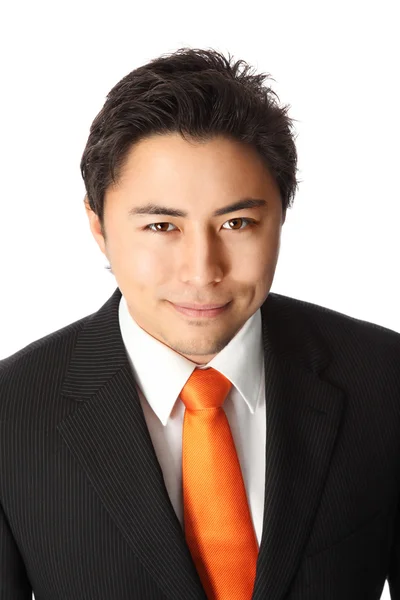 Businessman in orange tie and suit — Stock Photo, Image