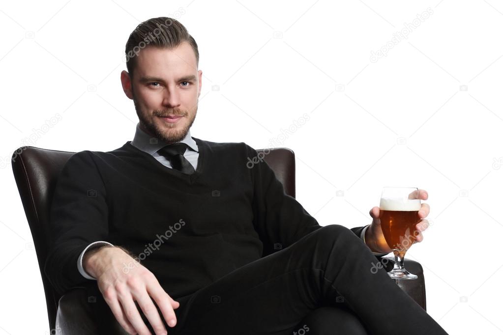 Handsome businessman with beer