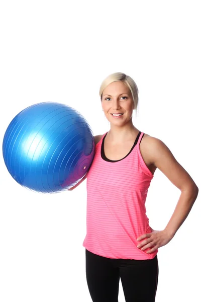 Attractive blonde woman working out in a pink shirt — Stock Photo, Image