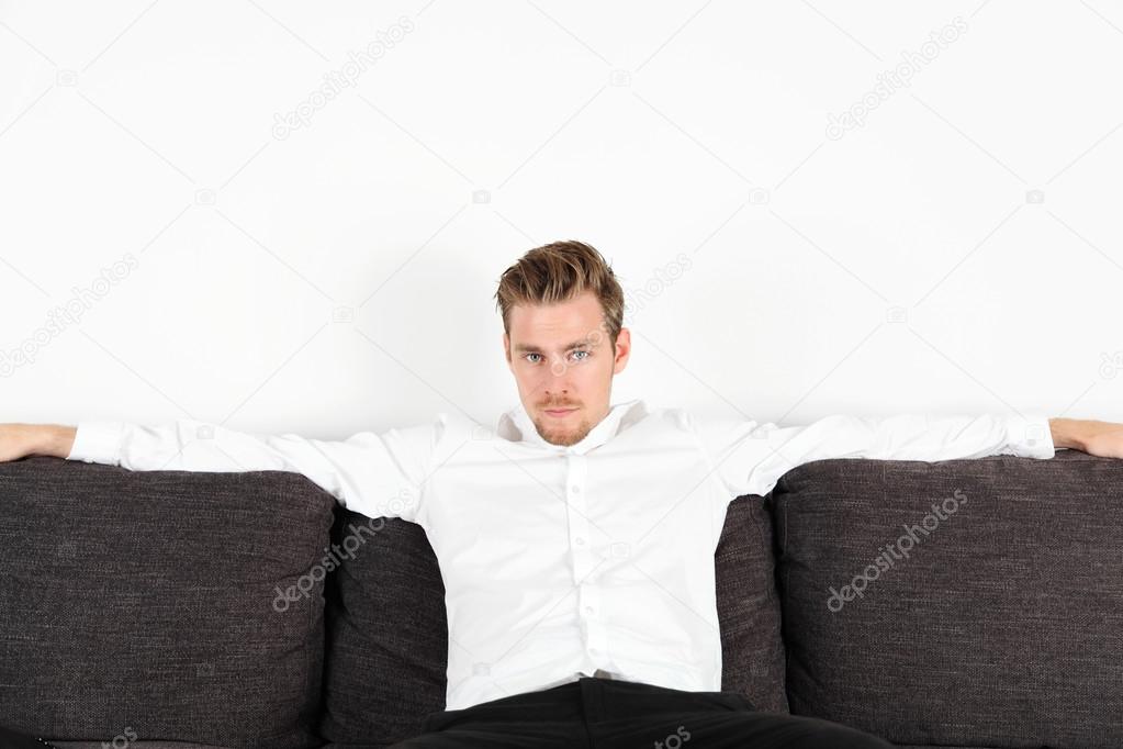 Man sitting down indoors