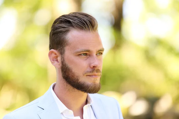 Portrait of an attractive man standing outside — Stock Photo, Image