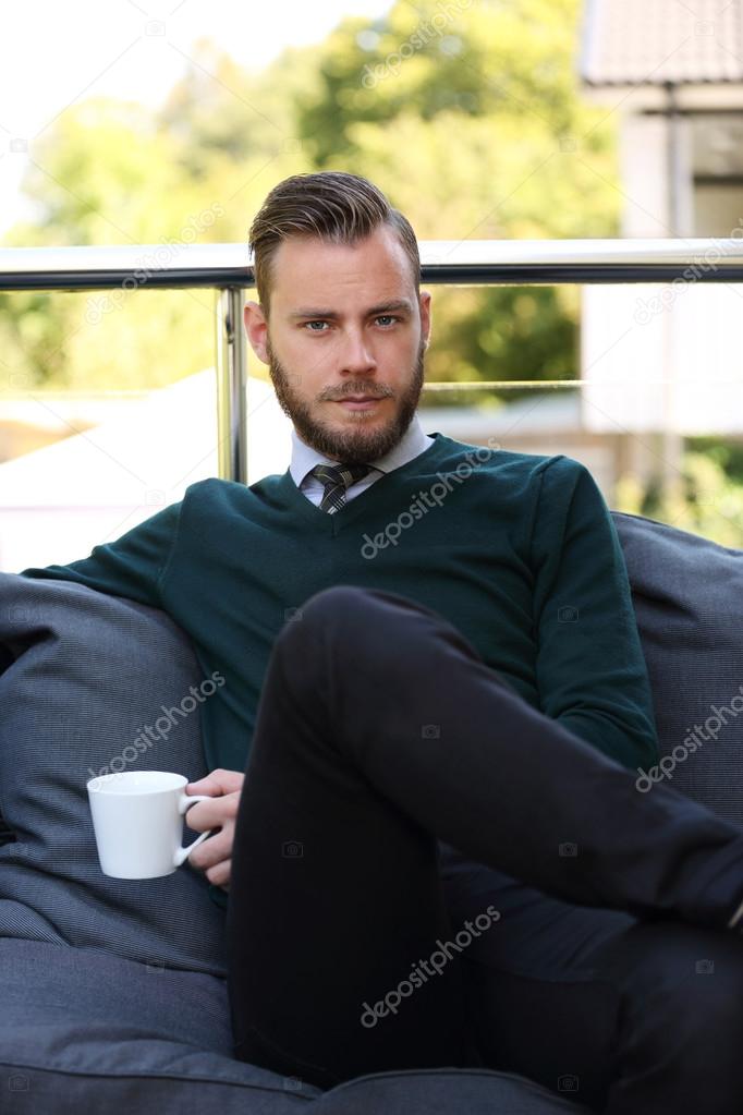 Businessman sitting down outdoors