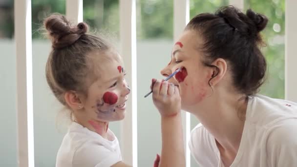 Happy Mom Daughter Play Paint Faces Colored Paints Background Summer — Stock Video