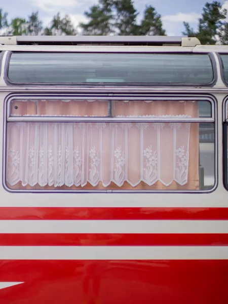 Old vintage bus for camping with red and white colors