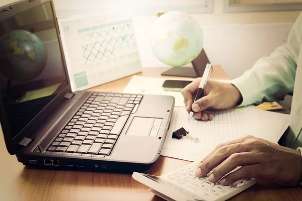 Man working on office desk in vintage tone — Stock Photo, Image