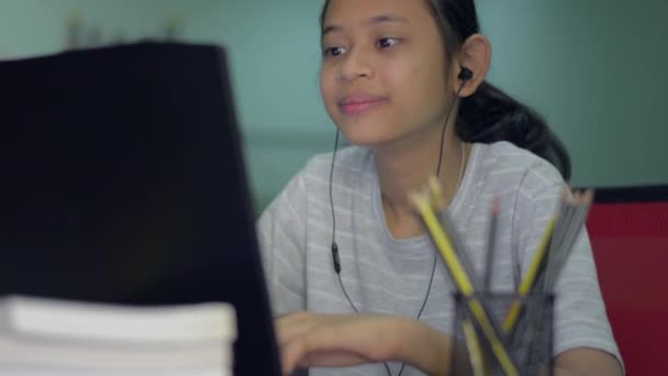 Cheerful Asian Young Girl Wears Earphone Playing Games Online Laptop — Stock Video